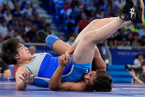 Nisha Dahiya and Sol Gum Pak compete during women's freestyle 68kg wrestling quarterfinal